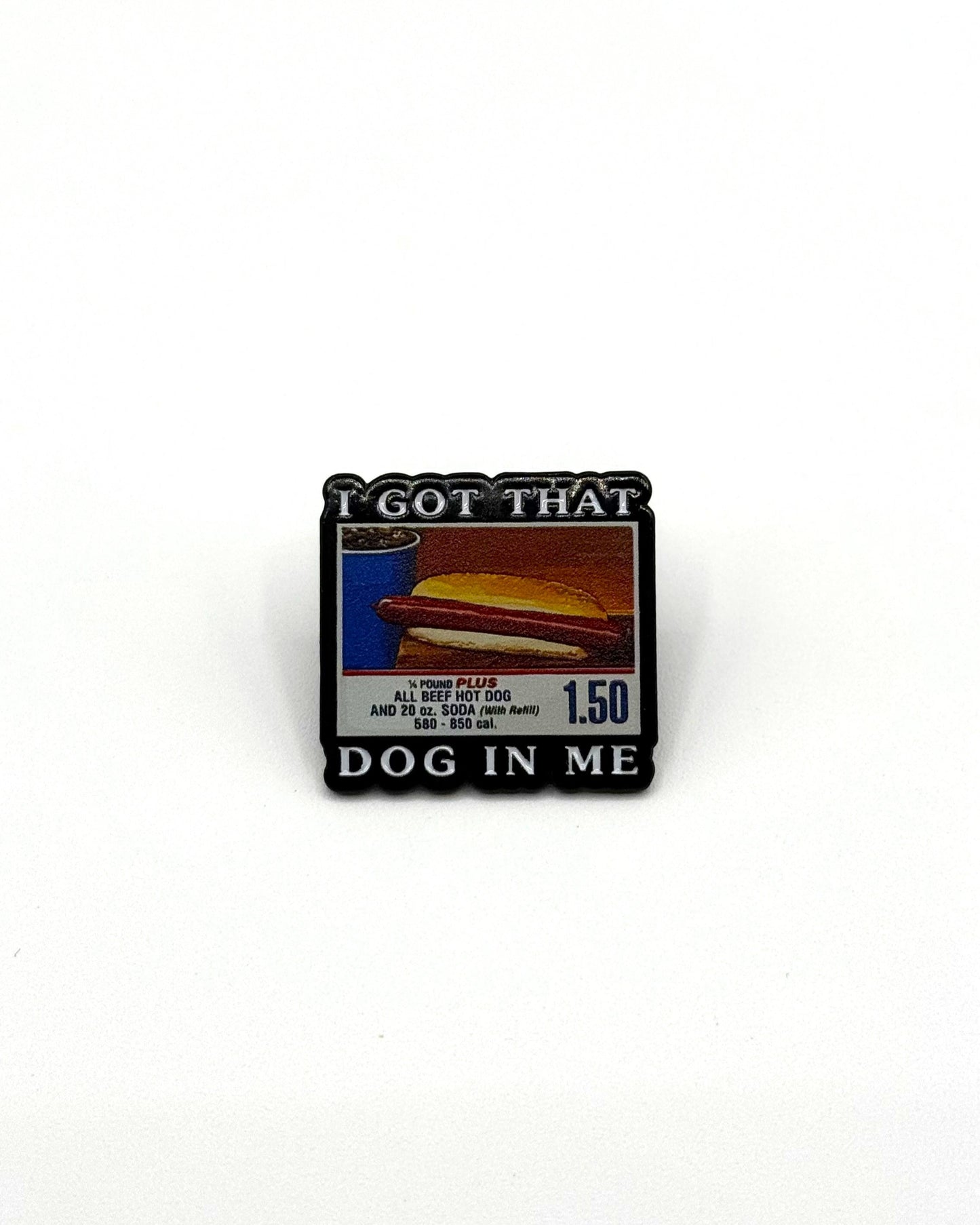 enamel pin displaying the 1.50 hotdog combo with text displaying i got that dog in me
